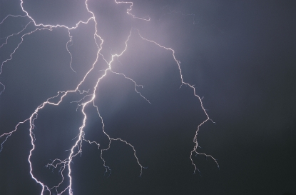Large lightning bolt in the night sky.