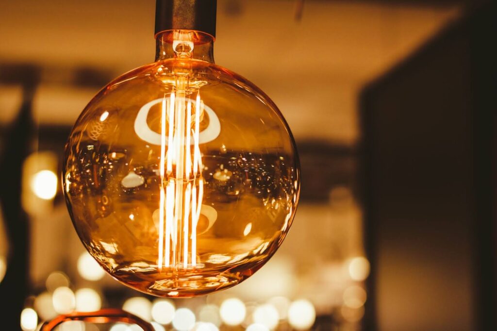 Close-up of a glowing vintage Edison light bulb.