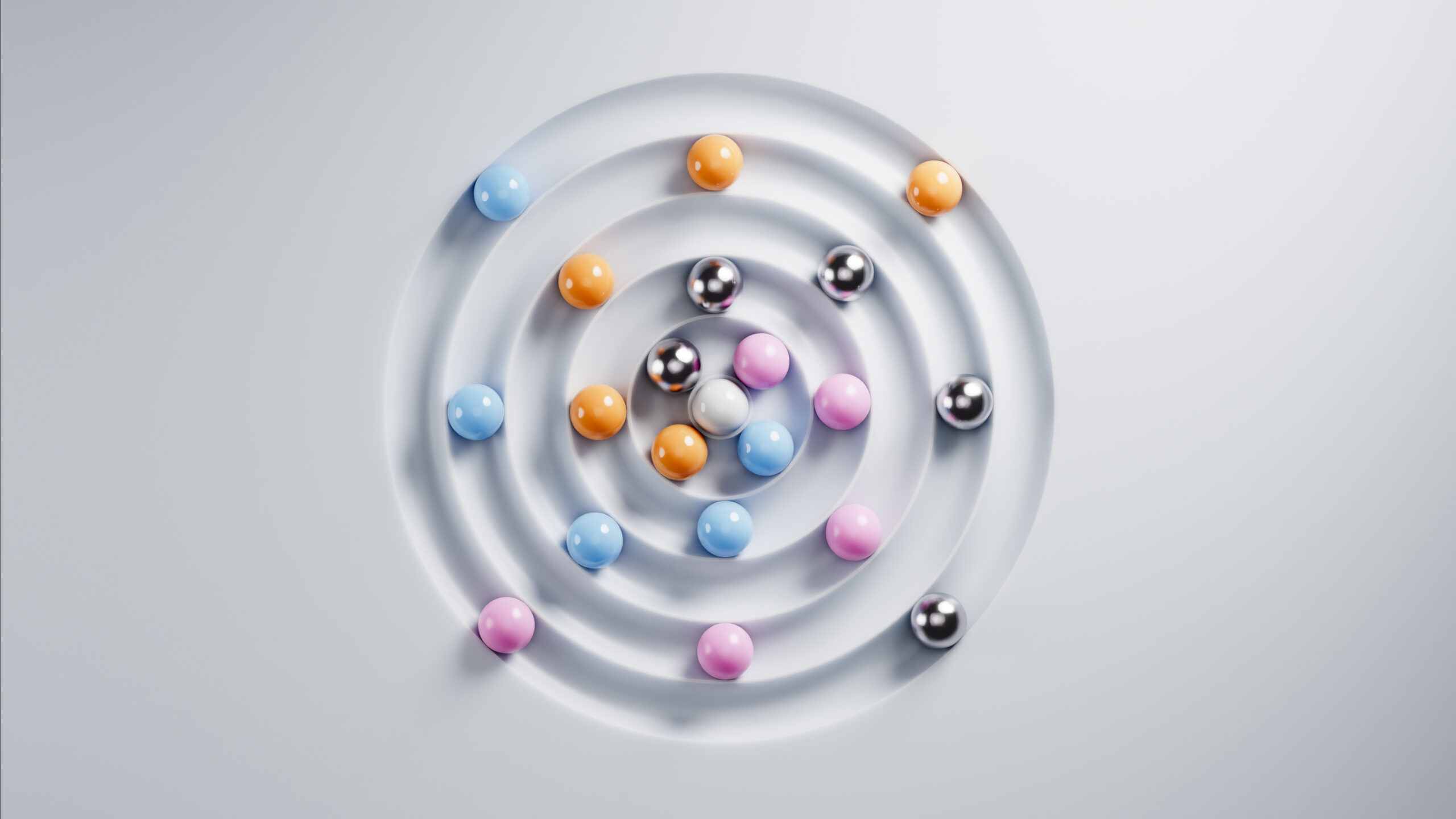 Colorful spheres are rolling towards the center of white concentric circles, creating a visually appealing abstract composition