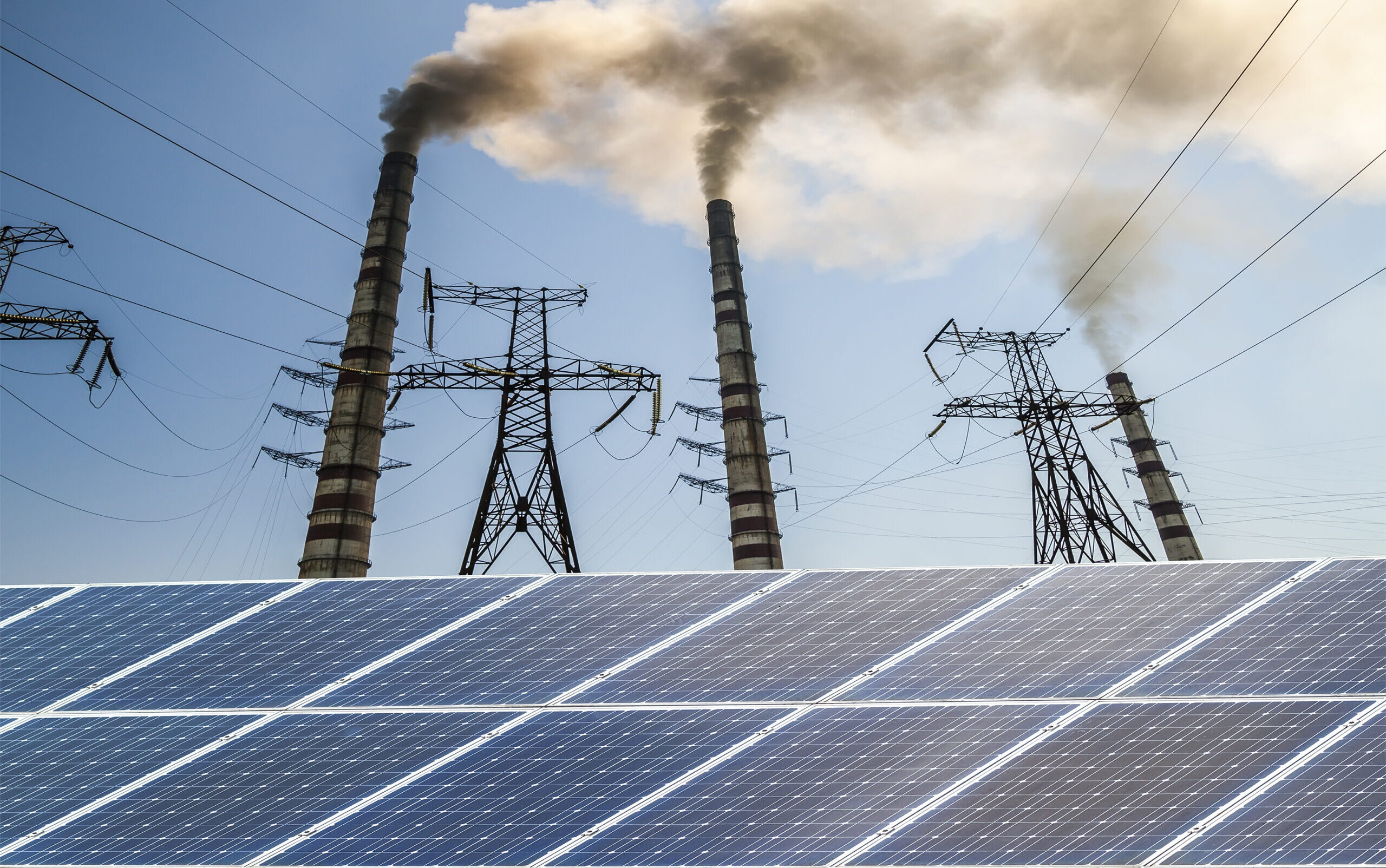 Solar panels against fuel coal power plant. Sustainable development and renewable resources concept.