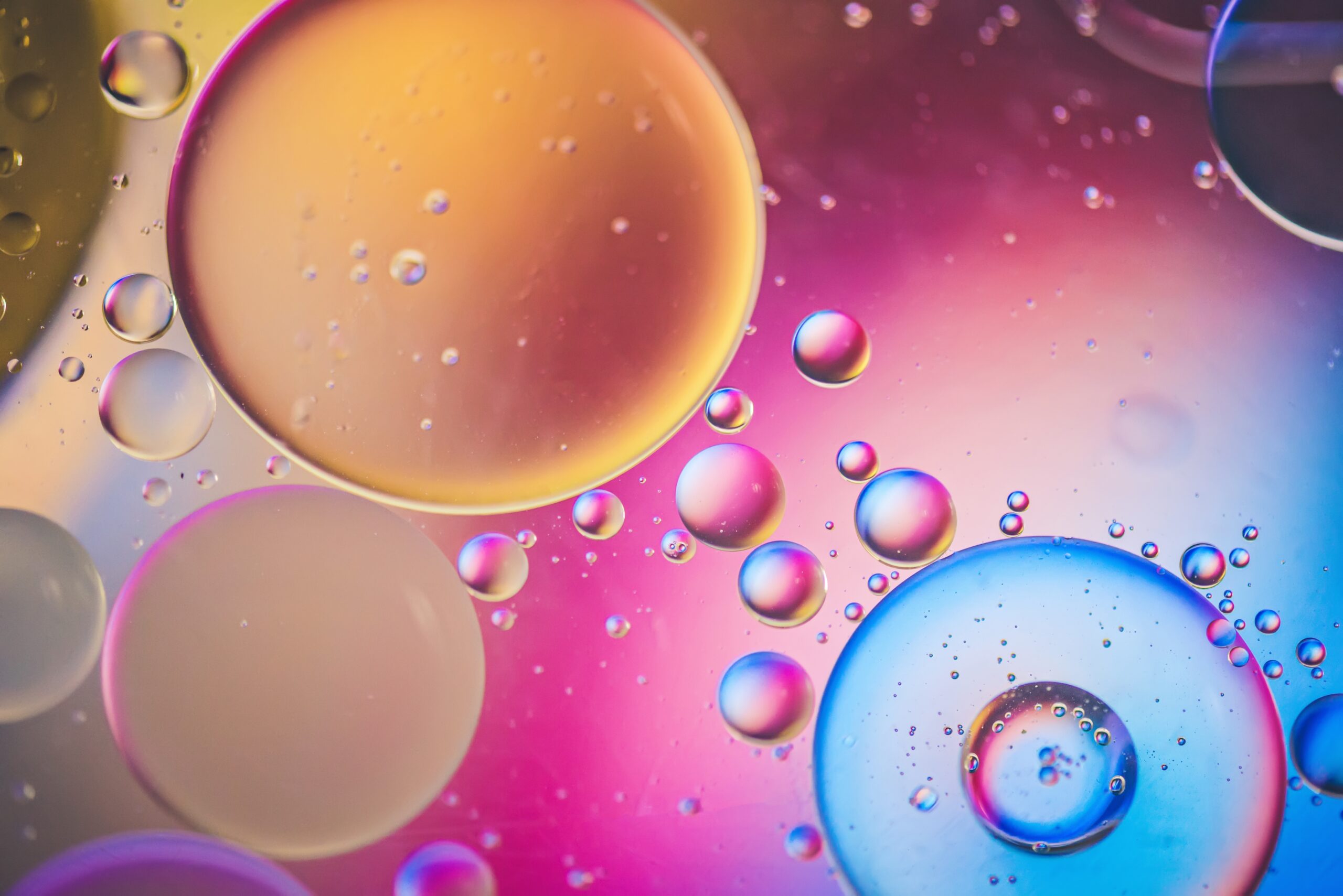 Colorful oil drops in water, close-up