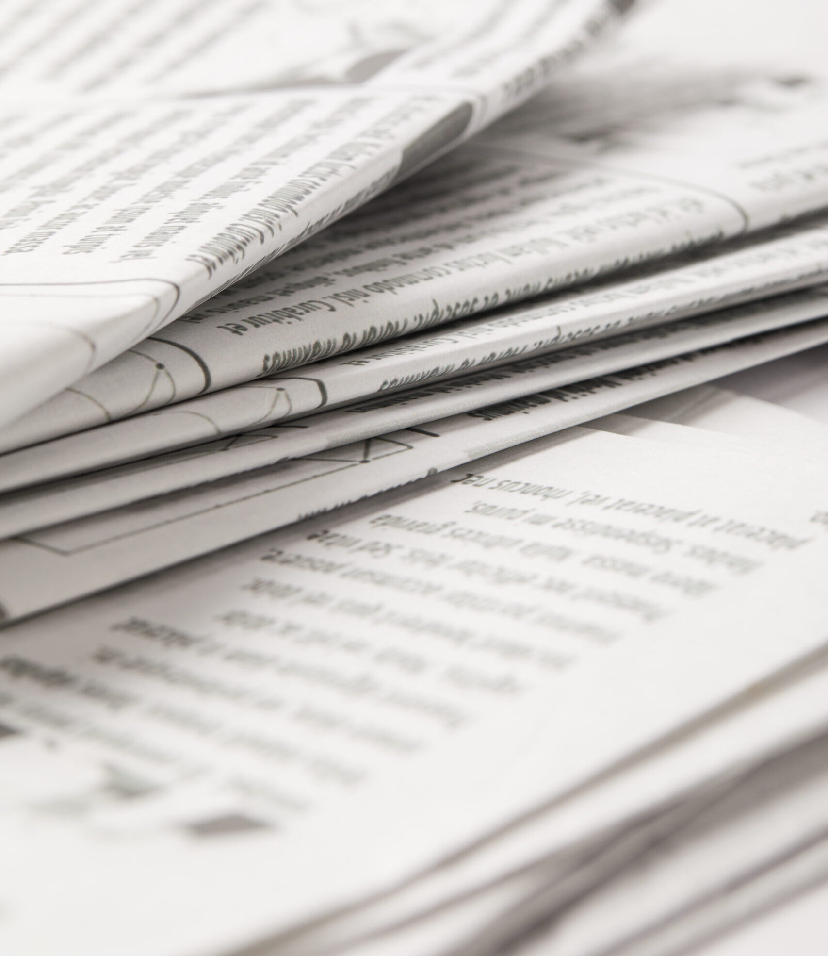 Close-up of newspaper stack